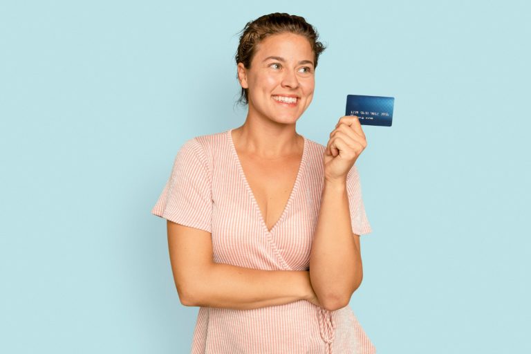 Woman holding her Capital One Platinum.