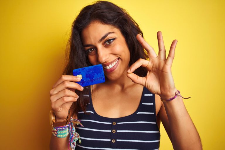 Woman happy with her Capital One Platinum Secured.