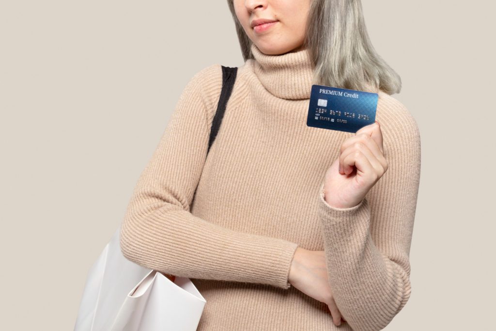 Woman using her Capital One Platinum Secured card.