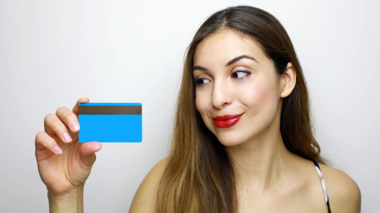 Woman holding her Chase Sapphire Preferred Card.