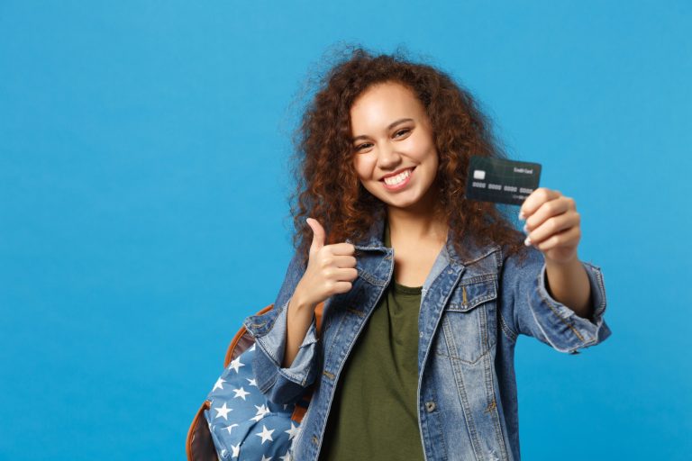 Woman holding her Discover it Student Cash Back.