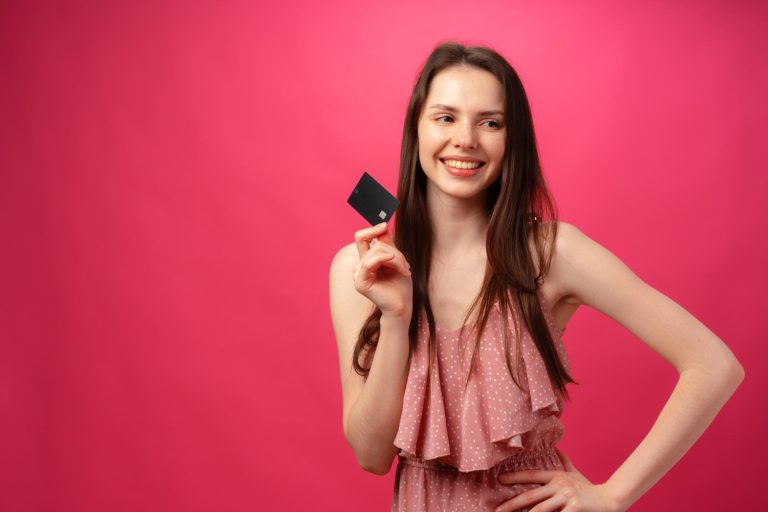 Woman holding her GM Business Card.