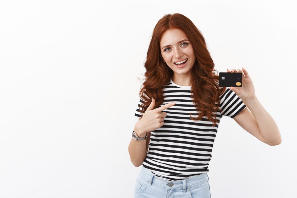 Woman holding her GM Business Card.