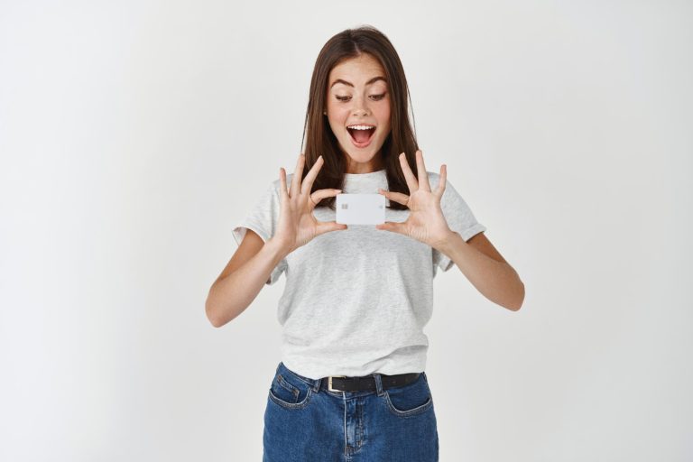 Woman holding her Hilton Honors American Express.