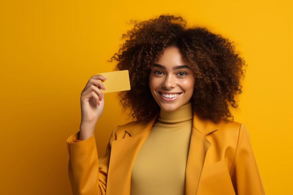 Woman using her Petal 2 Visa credit card.