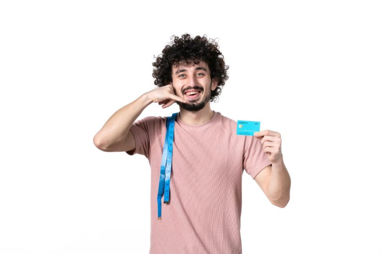 A man holding his Self Visa Secured Credit Card.