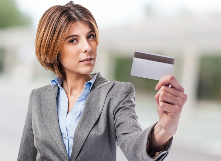 Woman holding her Southwest Rapid Rewards.