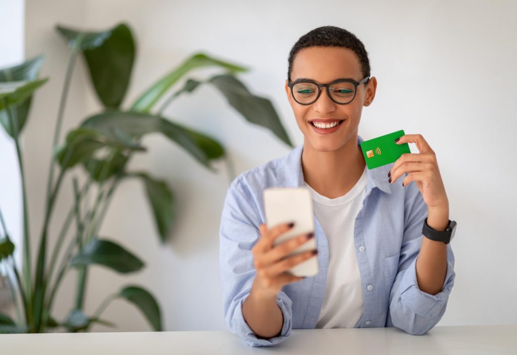 Woman holding her TD Cash Credit Card.