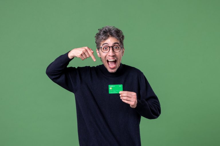 A man holding his TD Cash Credit Card.