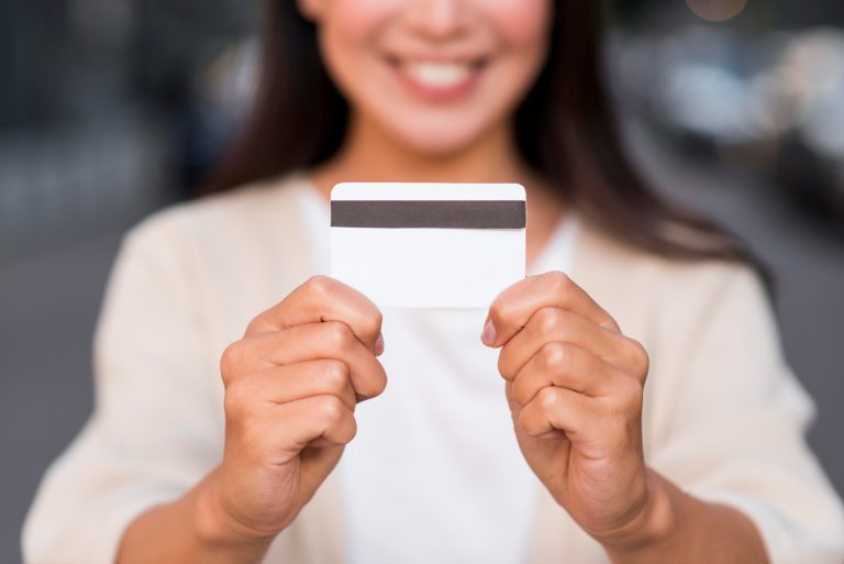Woman using her US Bank Cash Visa Signature card.