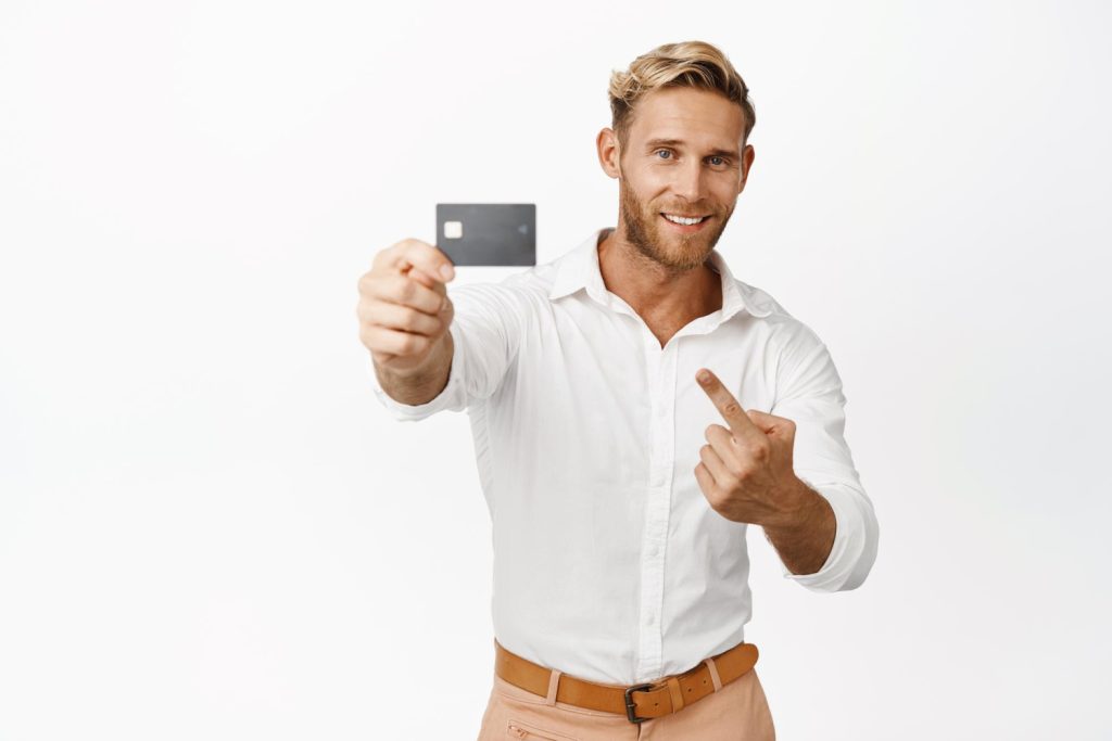 A man holding his Wells Fargo Active Cash Card.