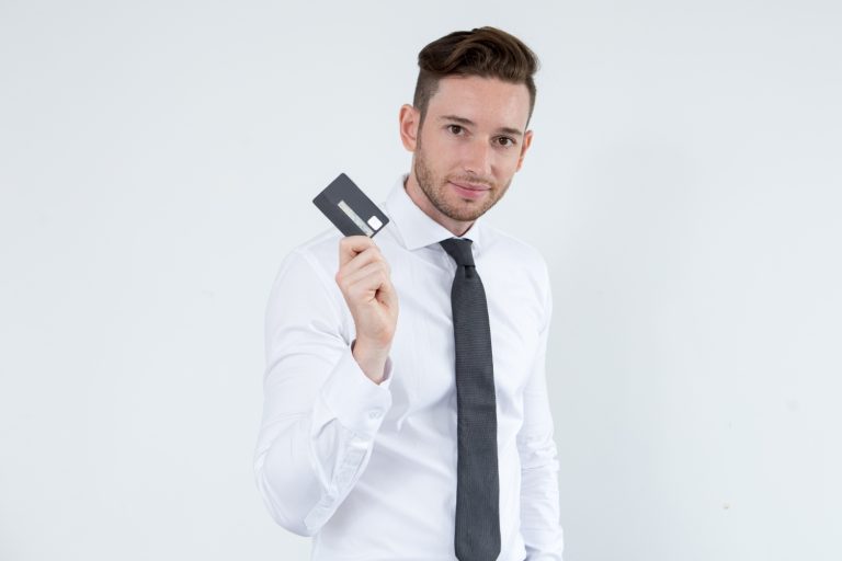 A man holding his Wells Fargo Active Cash.